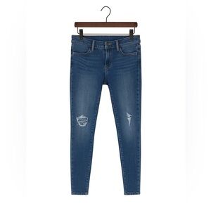 Articles of Society size 25 ripped skinny jeans with frayed bottoms.